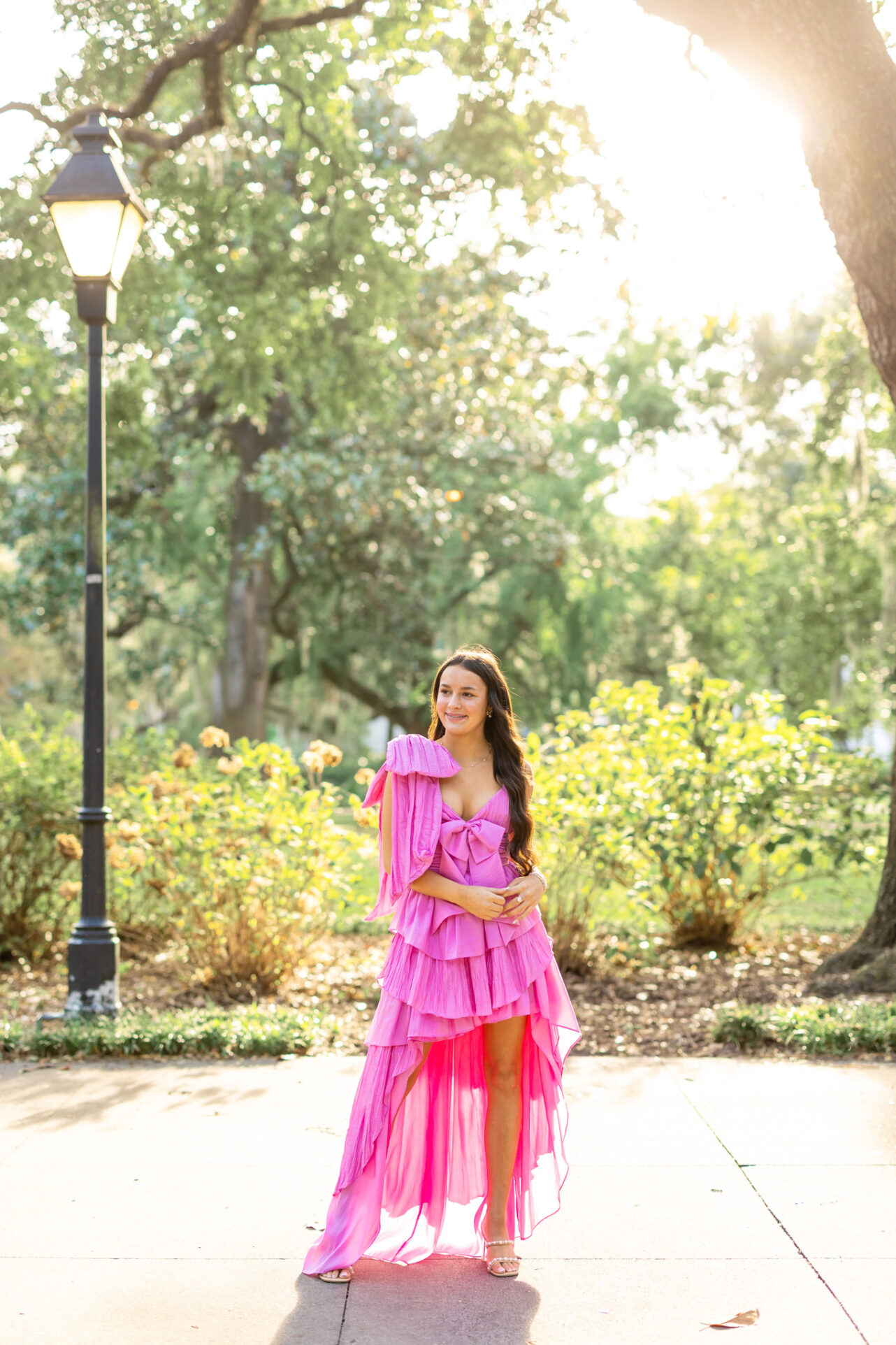 High School Stunning Girl in Forsyth Park, Savannah having her portraits done by Abi Faith