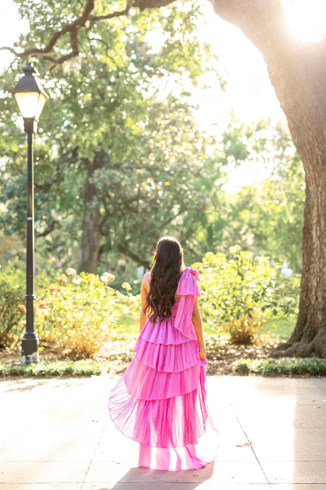 High School Stunning Girl in Forsyth Park, Savannah having her portraits done by Abi Faith